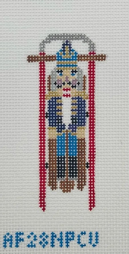 Sled With Purple Nutcracker