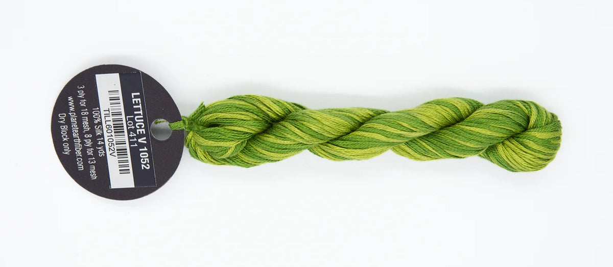 Braided green yarn with a label on a white background