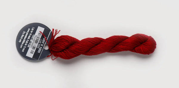 Red skein of yarn with a label on a white background