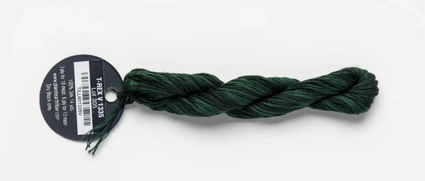 Green skein of yarn with a label on a white background