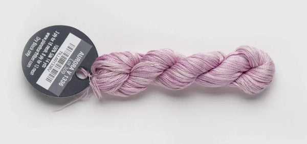 Pink skein of yarn with a label on a white background