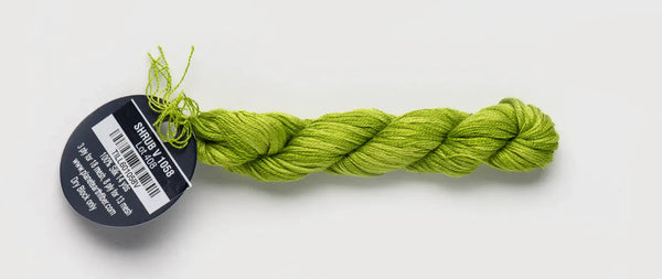 Green braided yarn with a label on a white background
