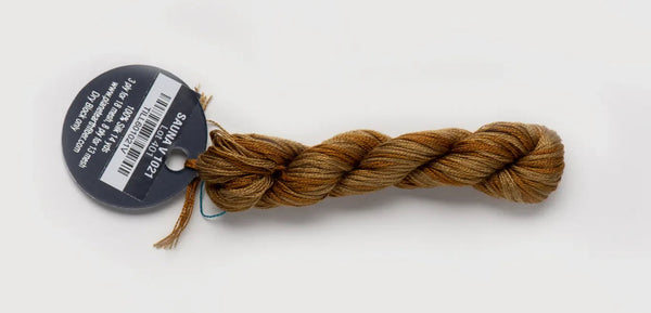 Brown braided yarn with a label on a white background